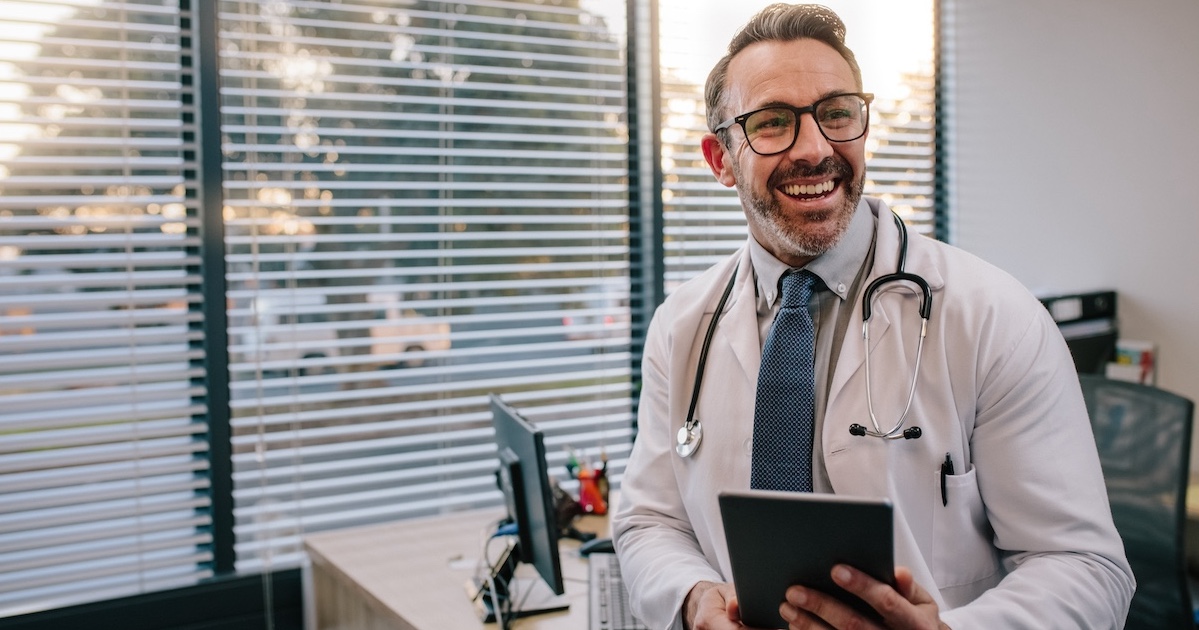 
  Physician holding a stethoscope and a tablet computer
