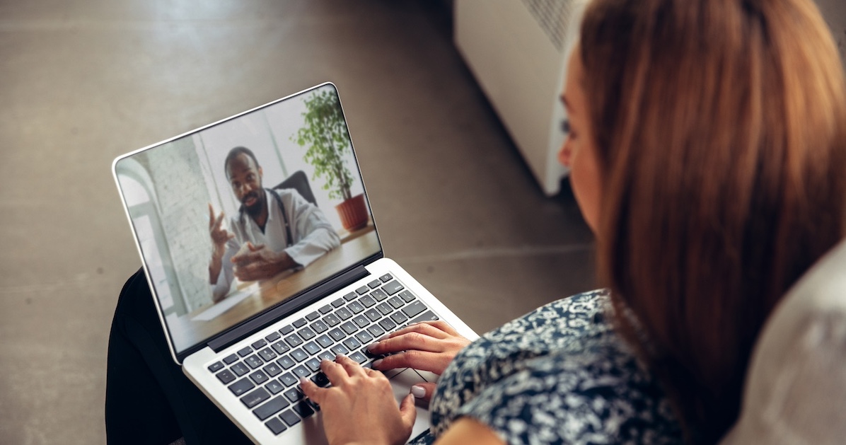 
  Patient interacting with healthcare professional via laptop
