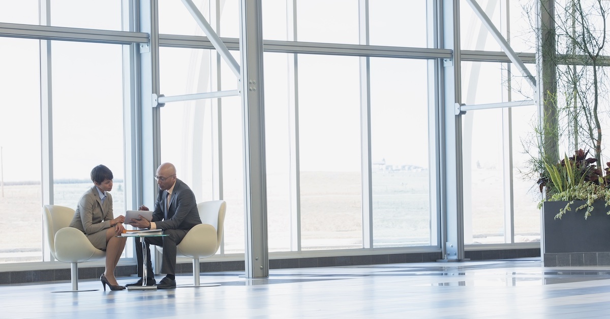 
  Two executives conferring 

