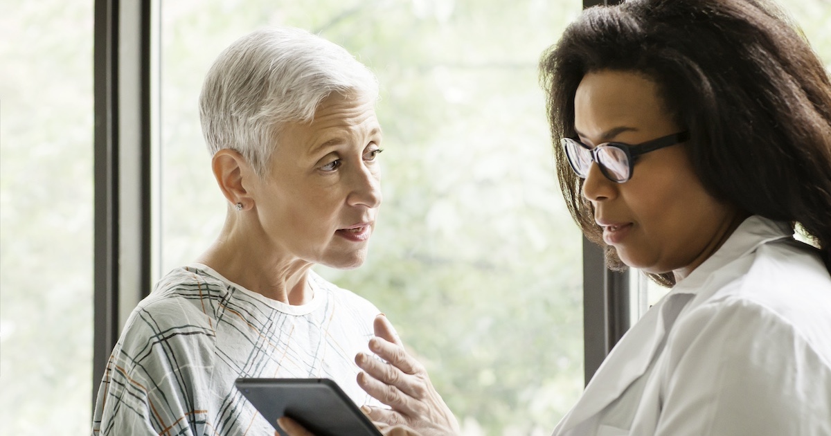 
  Healthcare professional consulting with patient

