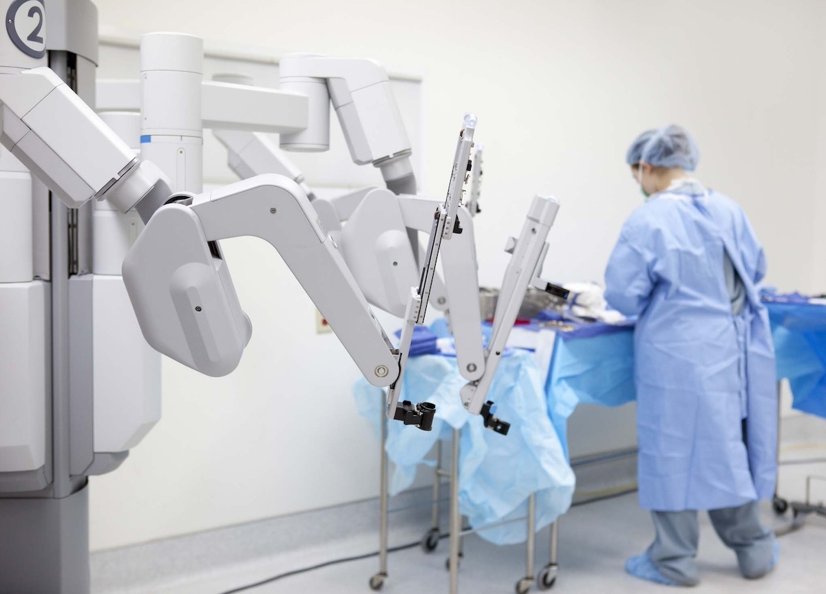 
  Technician preparing surgical robot 
