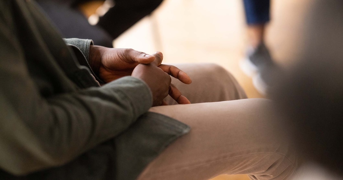 
  Person sitting in group therapy

