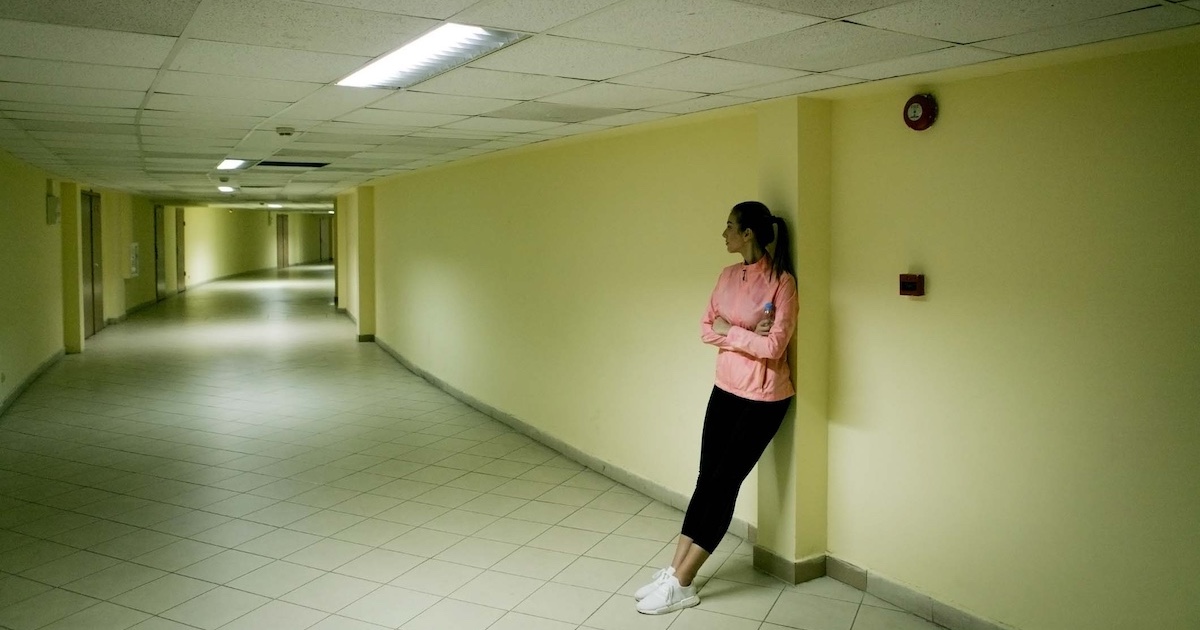 
  Person standing in the hall of a halfway house
