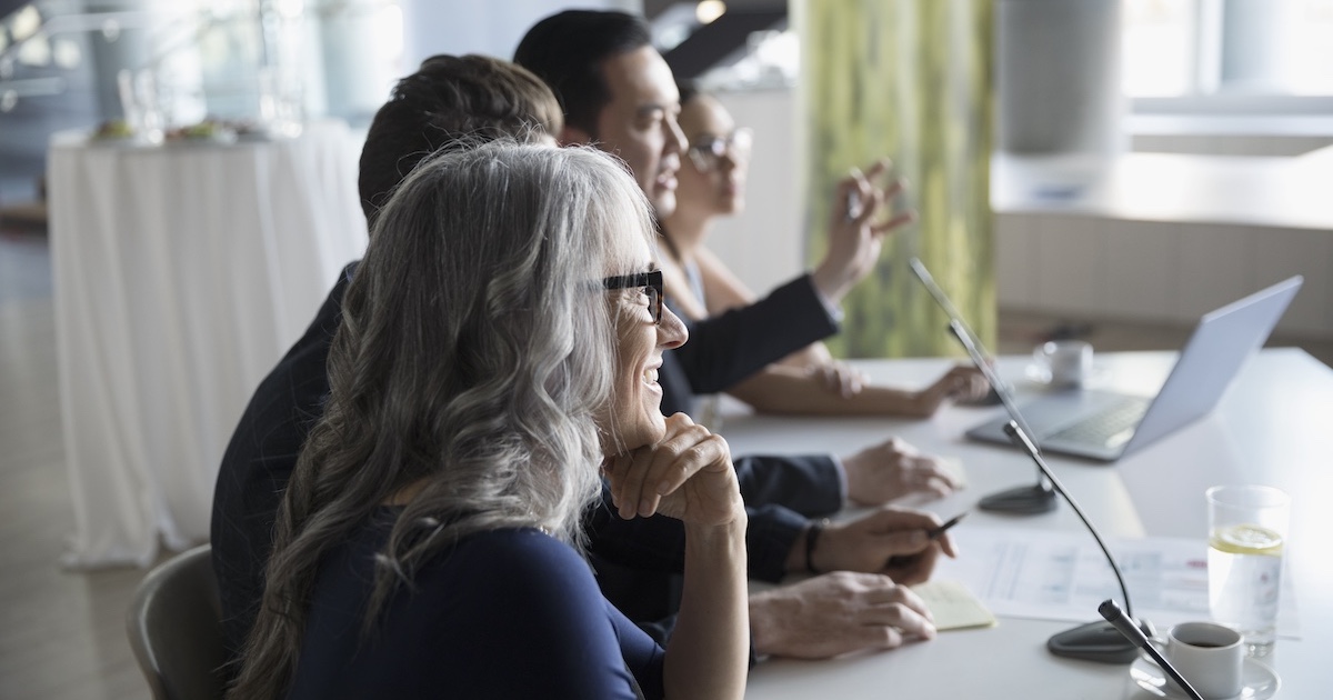 
  Executives gathered in a meeting
