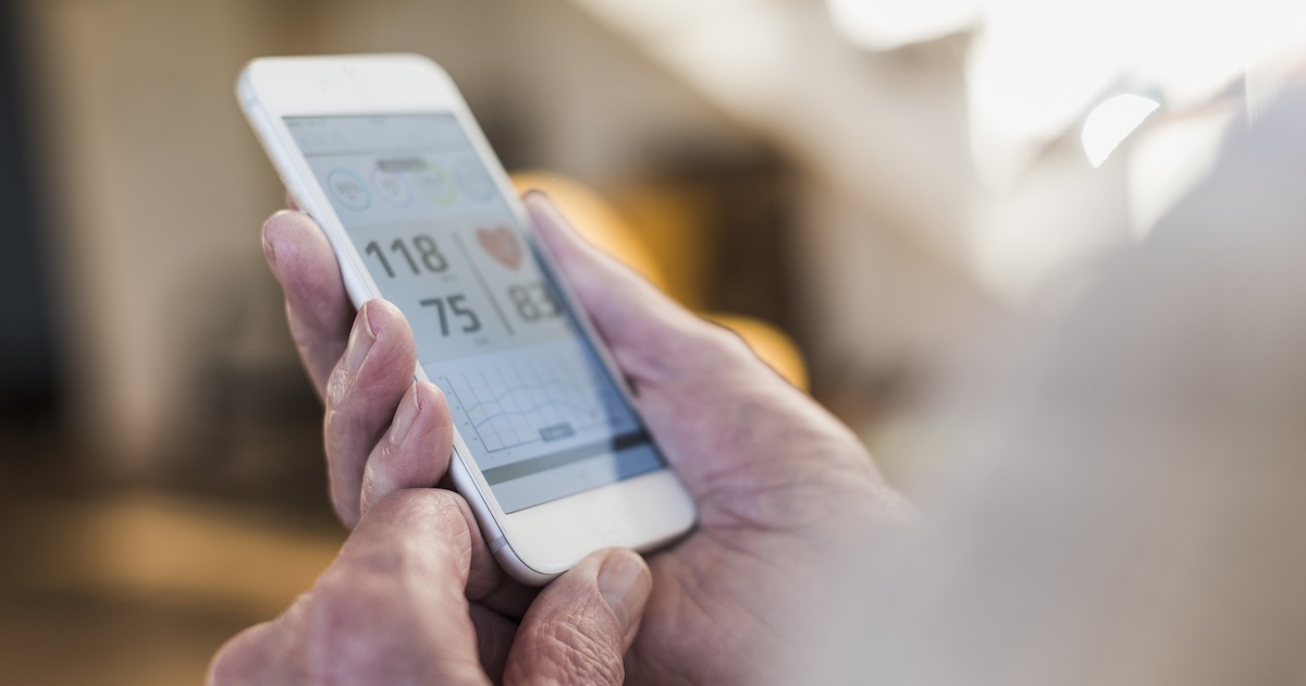 
  Photo of a smart phone showing blood pressure reading
