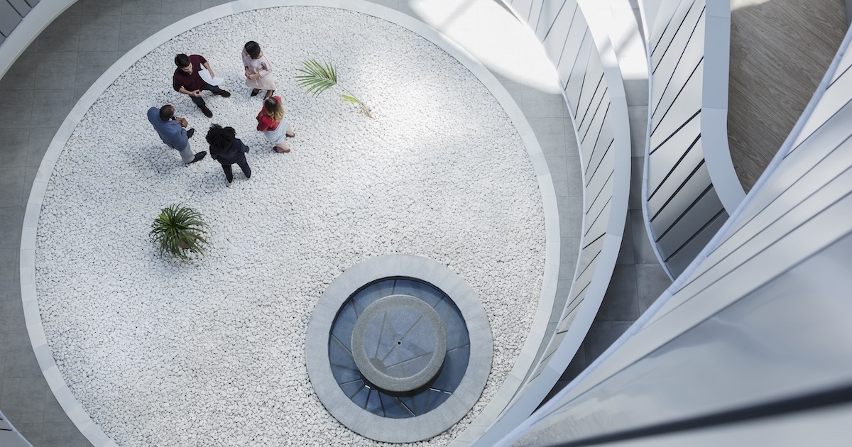 
  Employees gathering in an atrium 

