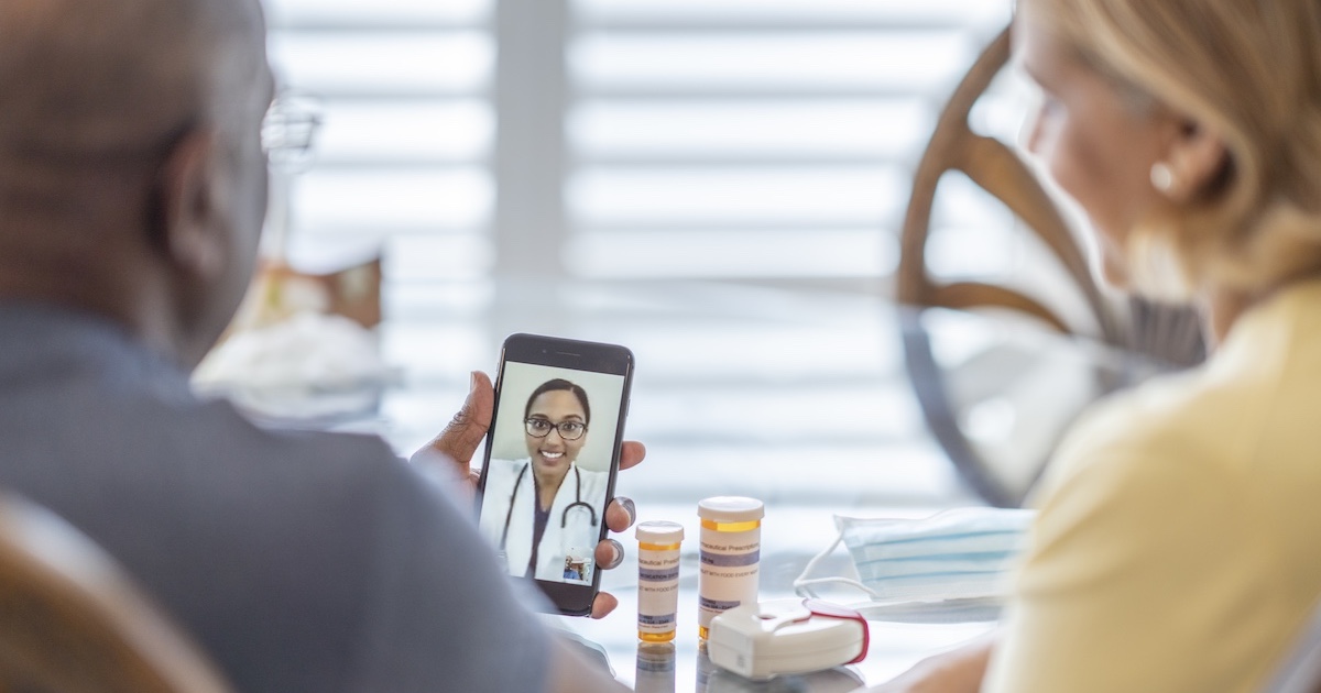
  People interacting with a healthcare professional via a smart phone
