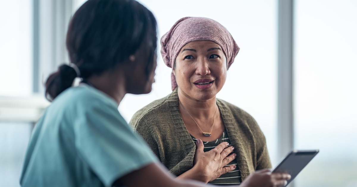 
  Healthcare professional consulting with patient 
