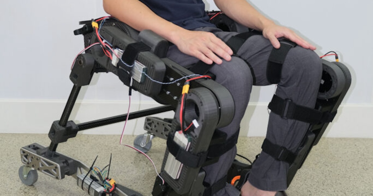 
  A person wearing the prototype hybrid wheelchair and exoskeleton
