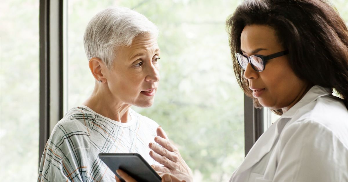 
  A doctor discussing findings with an older patient
