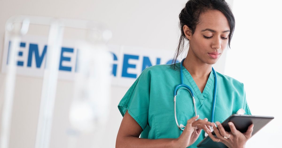 Healthcare professional looking at a tablet