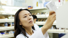 Pharmacist looking at a paper