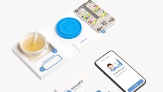 The Minuteful test kit, including a smartphone displaying the app