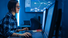 Technician looking at PC screen