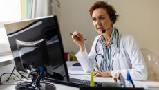 Healthcare professional looking at PC screen