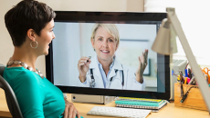 Pregnant women consulting with healthcare professional