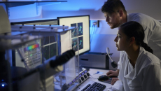 Healthcare professionals looking at telemetry