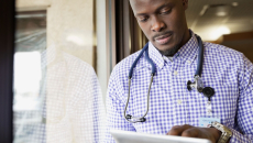 Healthcare provider looking at a computer