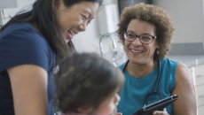A woman and child talking to a healthcare professional