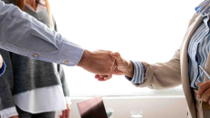 Man and woman shaking hands in the office