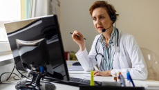 Healthcare professional interacting with a patient virtually