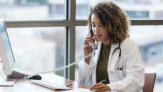 A doctor on the telephone, consulting