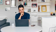 Person working on a laptop from home