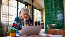 Person in their home on a computer