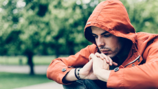 Depressed person sitting in the park