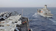 Aircraft carrier USS Dwight D. Eisenhower (CVN 69) and Military Sealift Command fleet replenishment oiler USNS Kanawha (T-AO 196) participate in a replenishment-at-sea