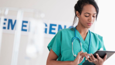 Healthcare professional looking at a tablet