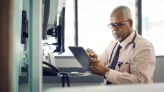 Physician using a tablet