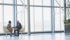 Two executives conferring