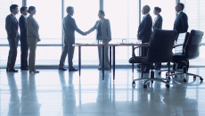 Executives discussing business deal