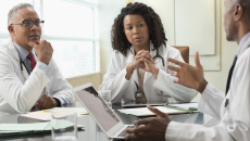 Healthcare professionals conferring