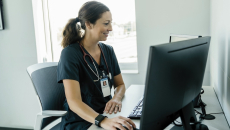 Healthcare professional looking at a PC screen