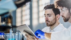 Two lab technicians at work