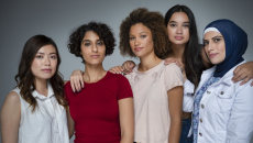 Five people standing by each other