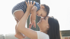 Person holding another smaller person above their head