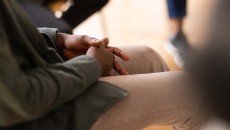 Person sitting in group therapy