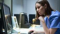 Technician reviewing MRI data