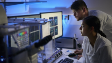 Healthcare professionals reviewing imaging on a PC