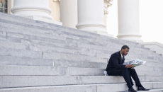 Man sitting on court building steps