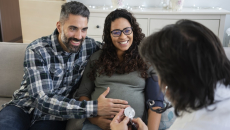 Couple, pregnant women consulting with a healthcare professional