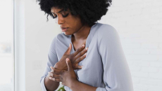 Person holding their chest