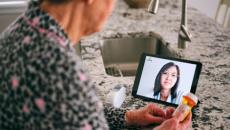 person looking at tablet screen