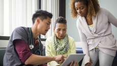 Healthcare provider consulting with a patient and family member