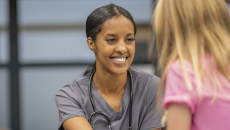 Person sitting with a school nurse