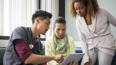 Physician consulting with a patient and family member