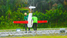 Two individuals preparing a done